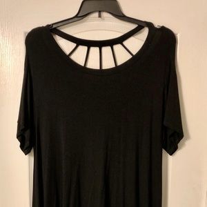 Black knit handkerchief hem, caged back shirt.